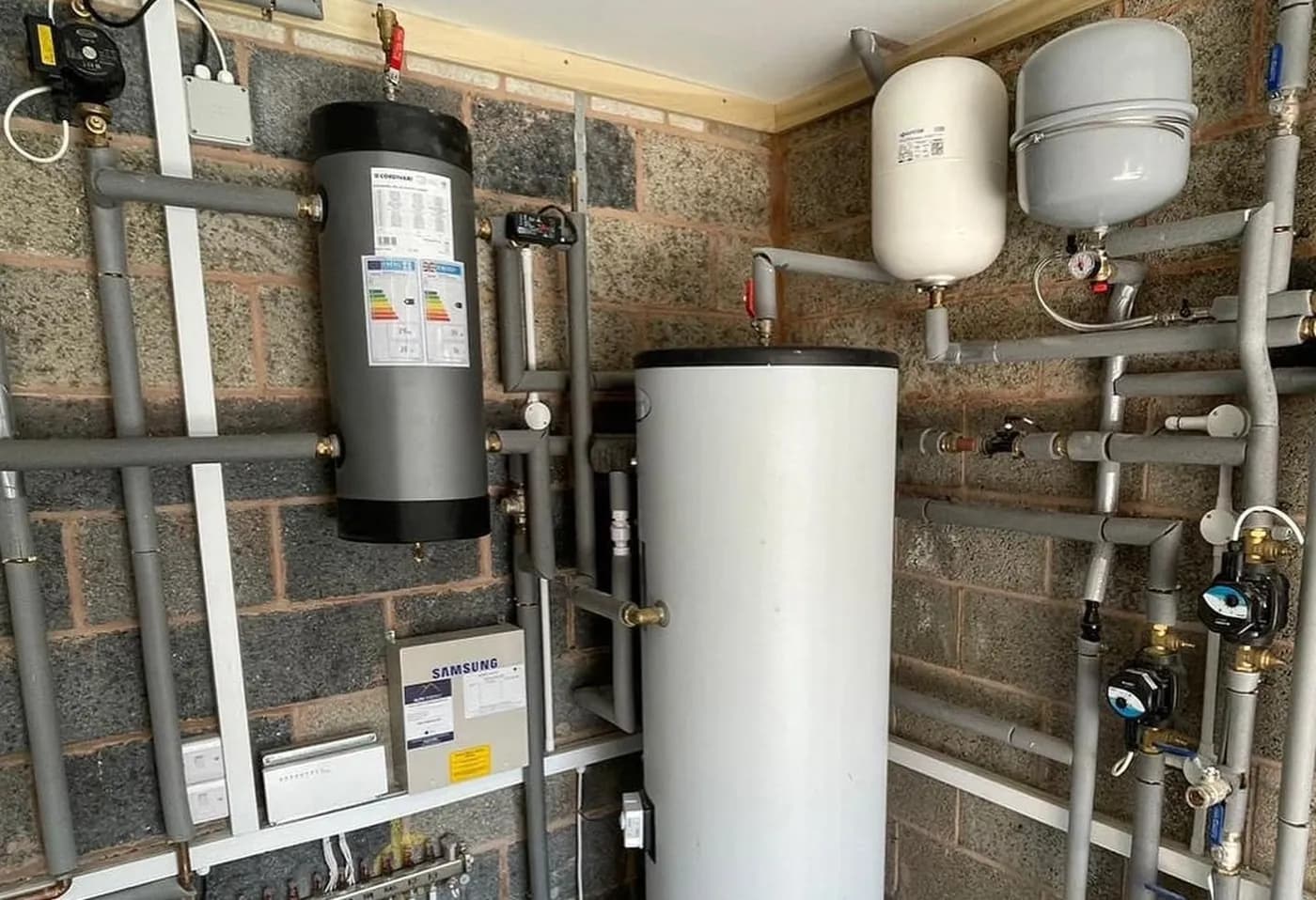 Plant room with hot water cylinder, buffer tank and expansion vessels