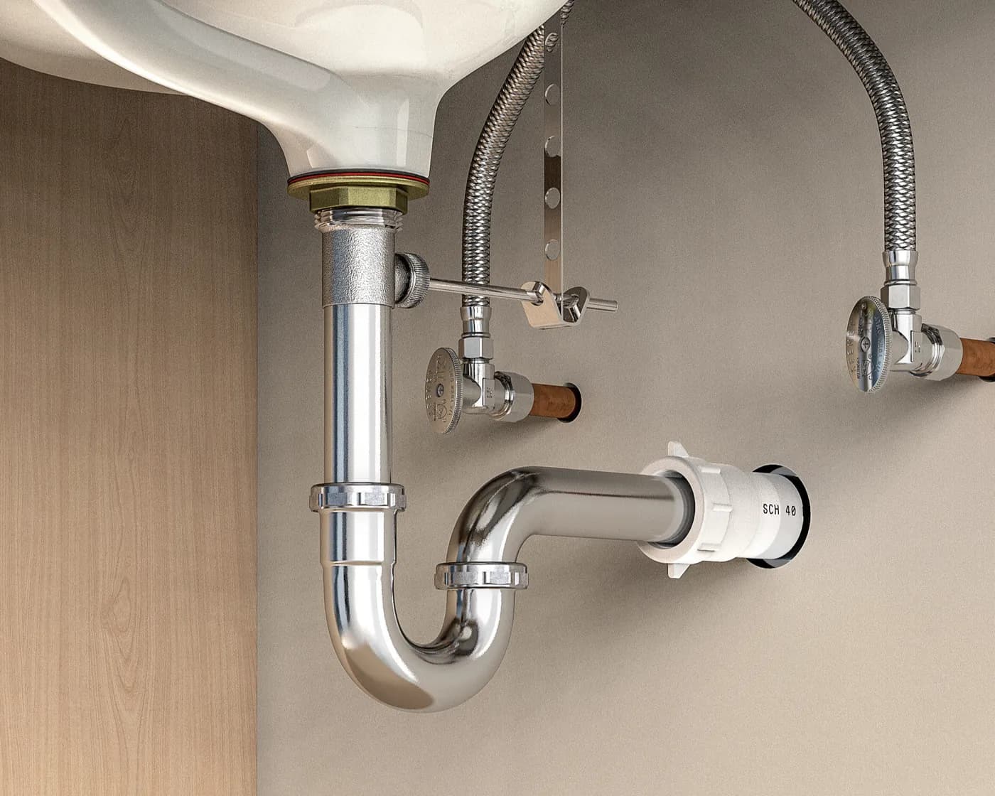 Chrome waste trap and isolation valves under a basin